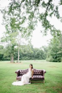 bride on vintage couch outside