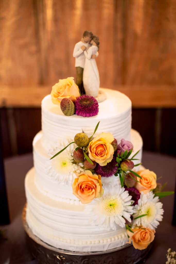 3 tier wedding cake with fresh flowers