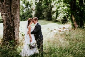 bride and groom in woods at vintage wedding venue in georgia