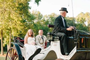 horse and buggy bride and groom at vintage wedding venue in georgia