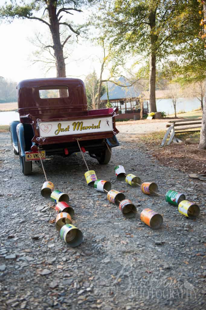 just married cans on rustic truck at vintage wedding venue in georgia